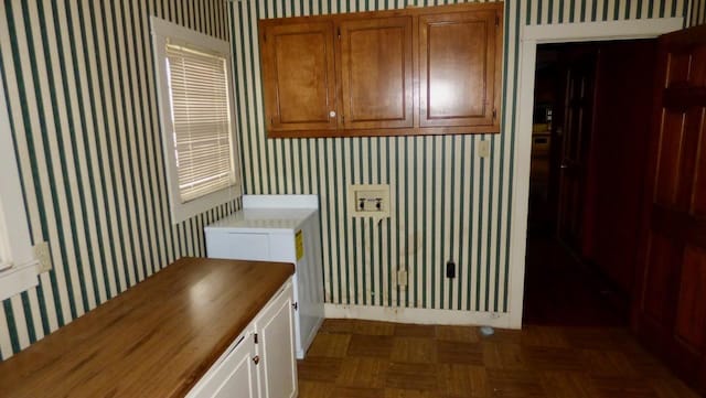  - washroom featuring wallpapered walls and baseboards
