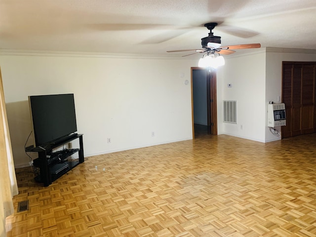 unfurnished living room featuring heating unit, crown molding, a textured ceiling, and light parquet flooring