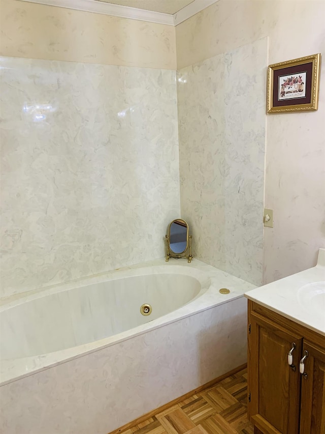 bathroom with vanity, a tub, and parquet flooring