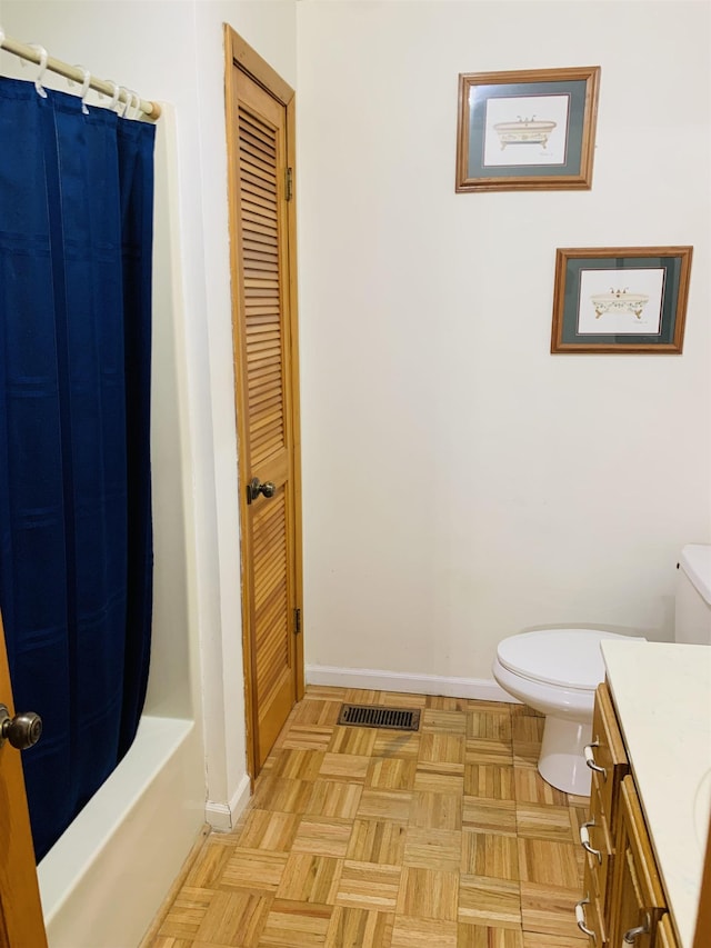 full bathroom featuring parquet flooring, shower / bathtub combination with curtain, vanity, and toilet