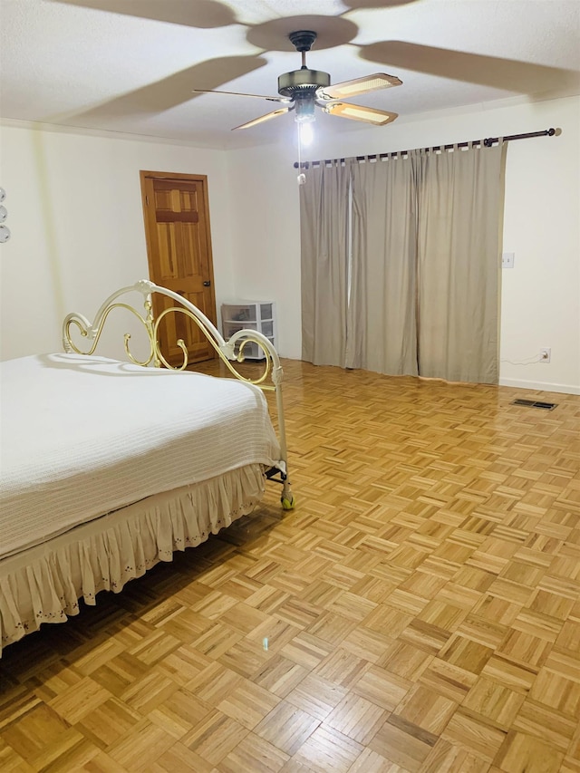 bedroom featuring light parquet flooring and ceiling fan