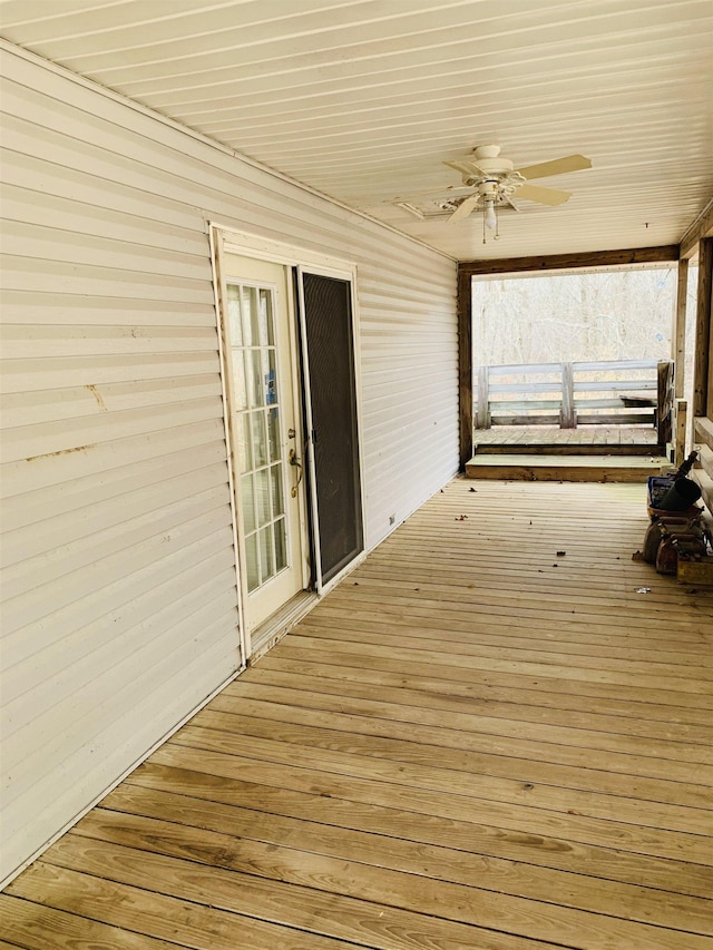 wooden deck with ceiling fan