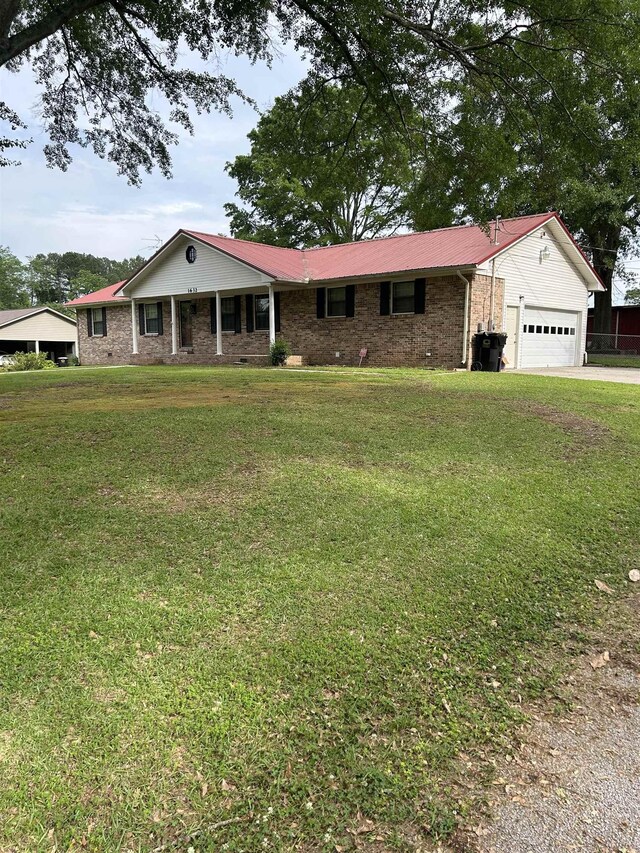  - ranch-style home with a garage, a front lawn, concrete driveway, and brick siding