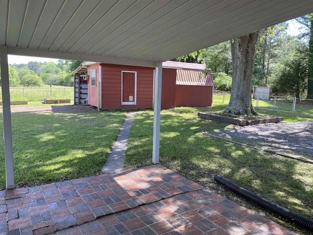  - view of yard with an outbuilding and a carport