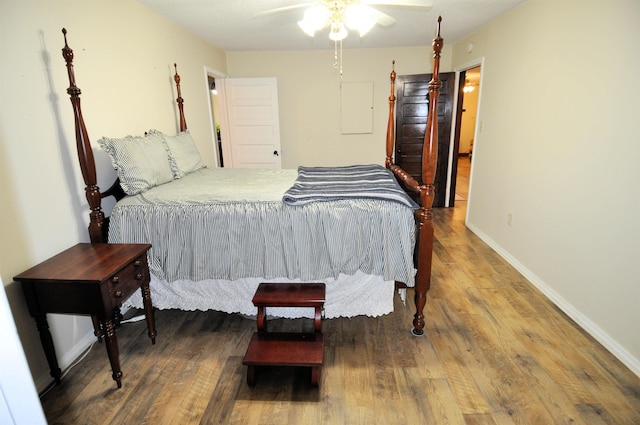 bedroom featuring dark hardwood / wood-style floors and ceiling fan