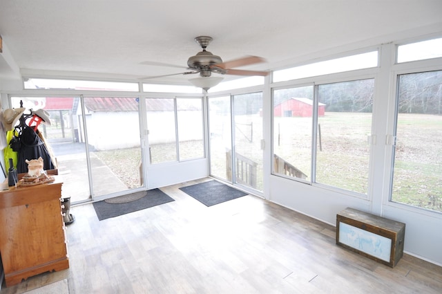 sunroom / solarium with ceiling fan