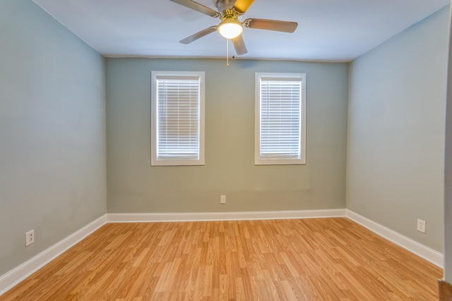 empty room featuring ceiling fan and light wood-type flooring