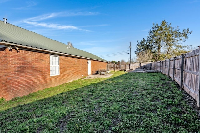  - fenced backyard featuring a patio