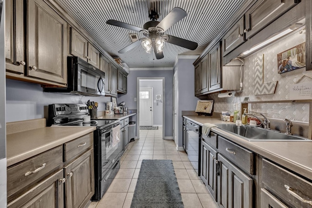  - kitchen with black appliances, a ceiling fan, light tile patterned floors, light countertops, and crown molding