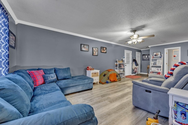  - living room with wood finished floors, ornamental molding, a ceiling fan, and a textured ceiling