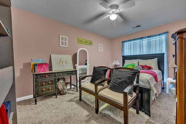  - bedroom with carpet flooring, a textured ceiling, and a ceiling fan