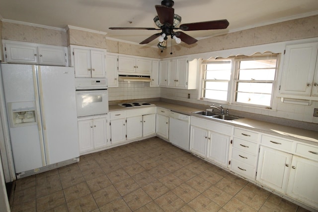 kitchen featuring crown molding, white appliances, and white cabinetry