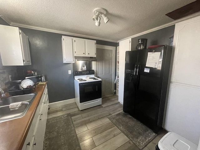 kitchen featuring sink, crown molding, electric range, white cabinets, and black fridge