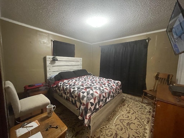 bedroom featuring ornamental molding and a textured ceiling