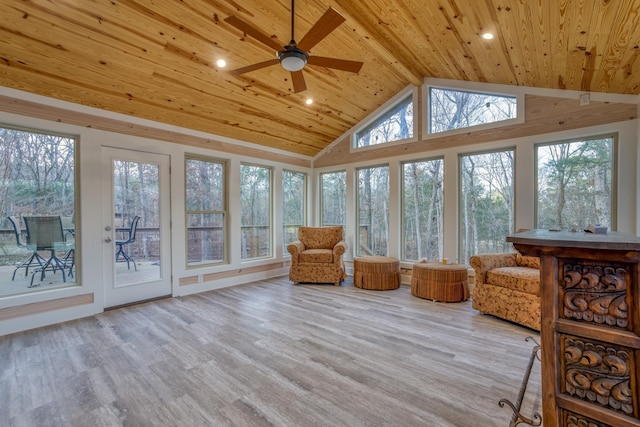 unfurnished sunroom with ceiling fan, lofted ceiling, and wooden ceiling