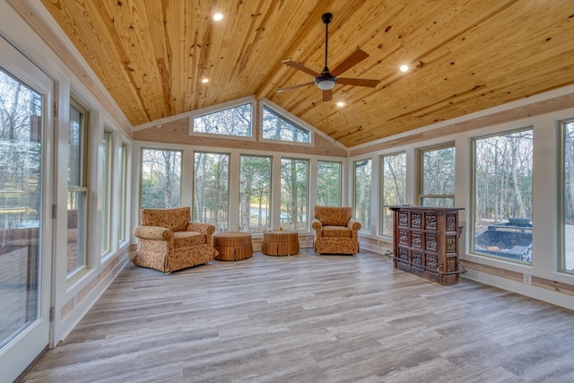 unfurnished sunroom featuring wood ceiling, ceiling fan, and vaulted ceiling with beams