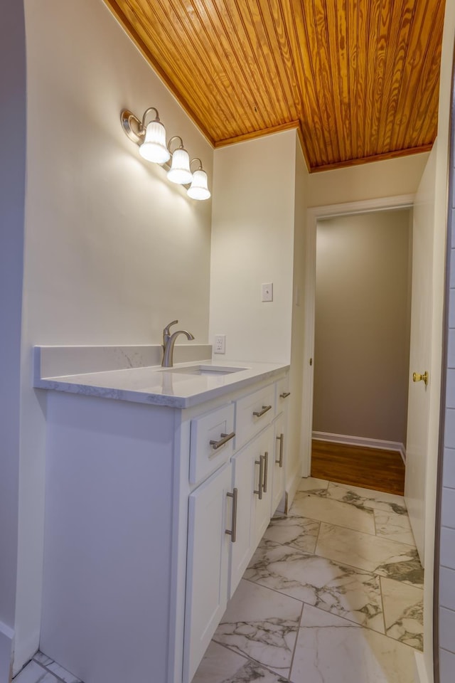 bathroom featuring vanity and wood ceiling