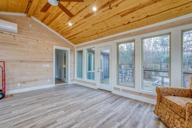 unfurnished sunroom featuring wood ceiling, ceiling fan, a wall mounted air conditioner, and vaulted ceiling