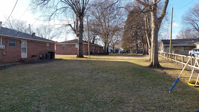 view of yard featuring a playground and cooling unit