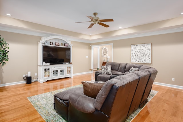  - living room with hardwood / wood-style floors, ceiling fan, and ornamental molding