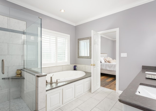  - bathroom with tile patterned floors, vanity, separate shower and tub, and ornamental molding