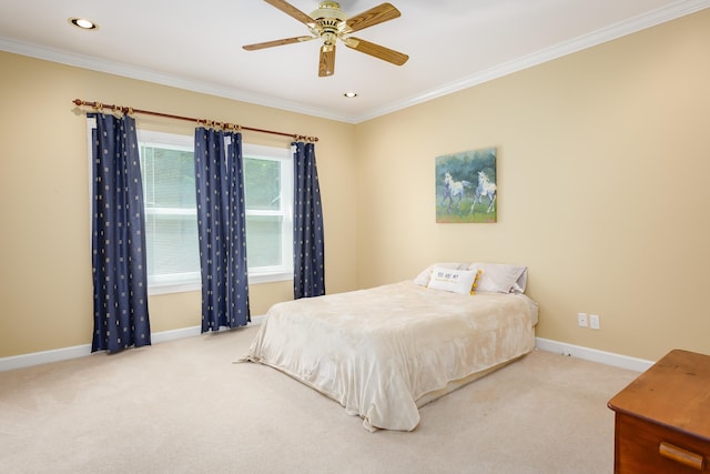  - bedroom featuring ceiling fan, crown molding, and light colored carpet