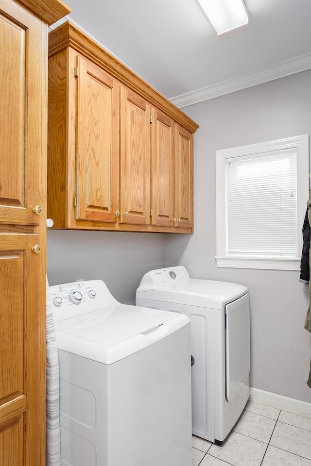  - laundry area featuring cabinets, light tile patterned floors, washer and clothes dryer, and crown molding