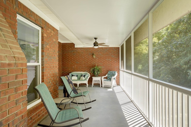  - unfurnished sunroom featuring ceiling fan