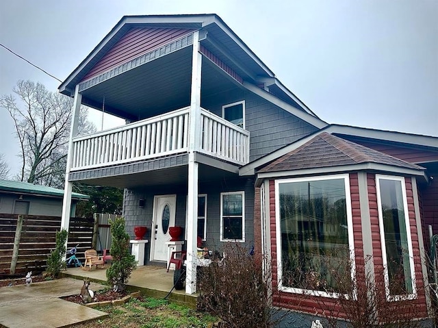 back of house with a balcony