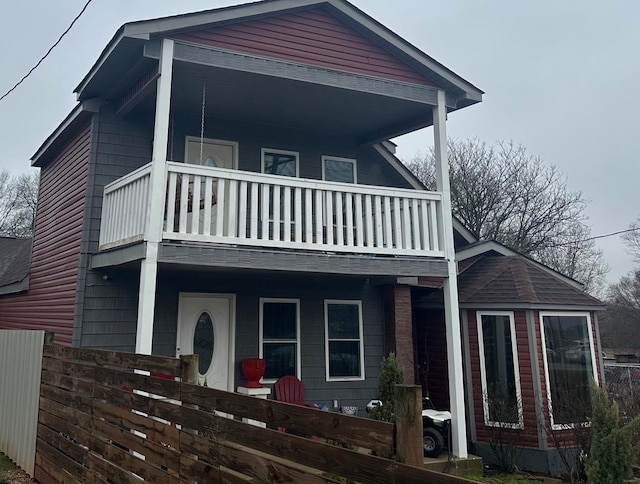 view of front facade featuring a porch and a balcony