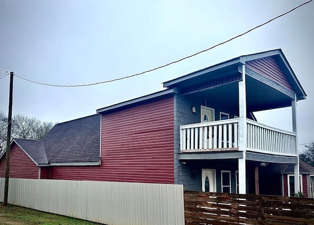 view of home's exterior featuring a balcony