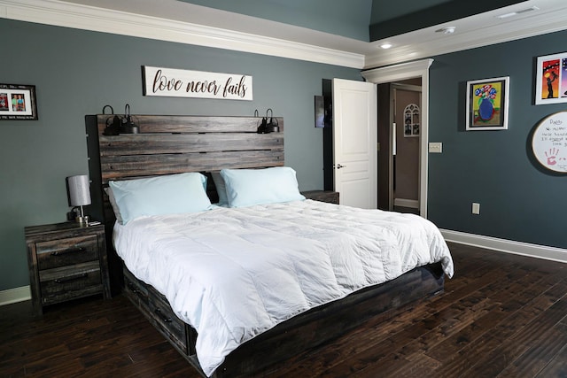 bedroom featuring visible vents, wood finished floors, and ornamental molding