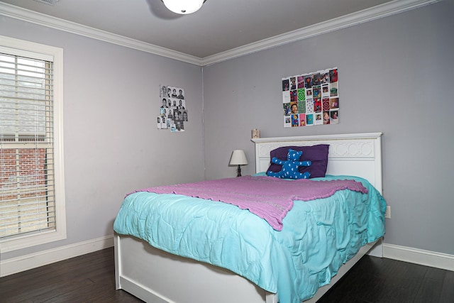 bedroom with wood finished floors, baseboards, and ornamental molding