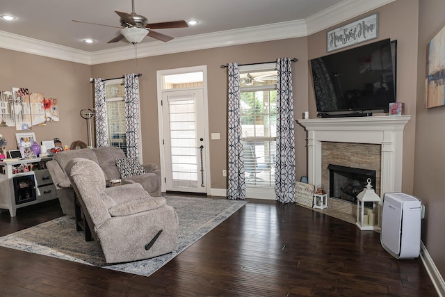 living room featuring dark wood finished floors and ornamental molding