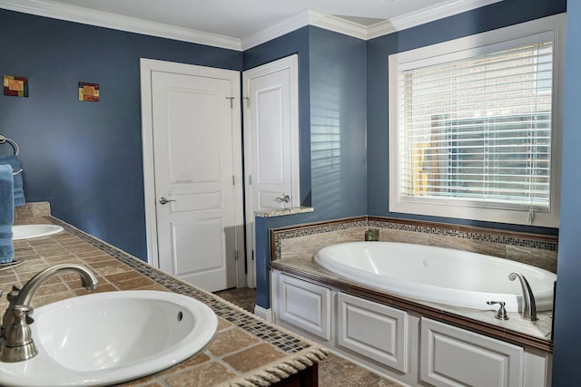 full bathroom featuring crown molding, a bath, double vanity, and a sink