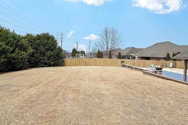 view of yard featuring a fenced backyard and a patio area