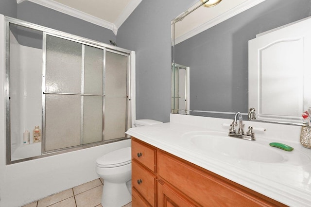 full bathroom featuring vanity, bath / shower combo with glass door, tile patterned flooring, toilet, and ornamental molding