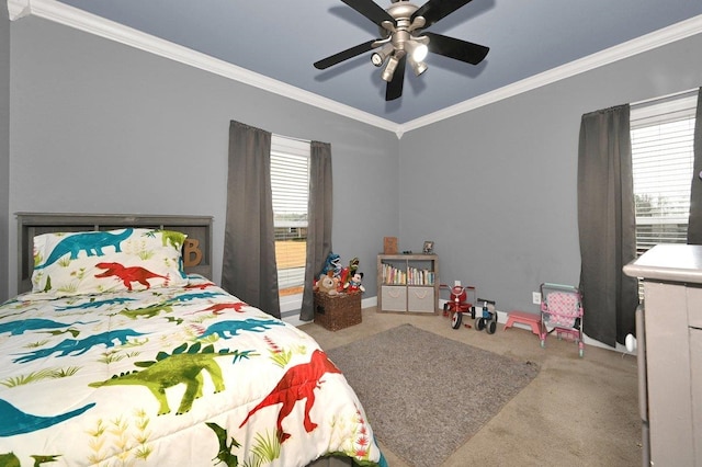 carpeted bedroom featuring multiple windows, ceiling fan, and ornamental molding