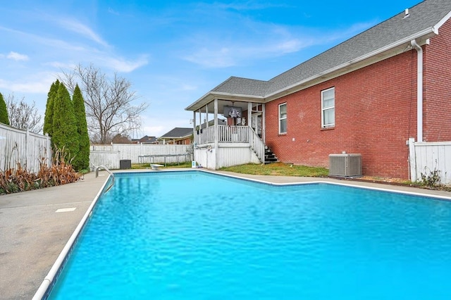 view of pool with central air condition unit