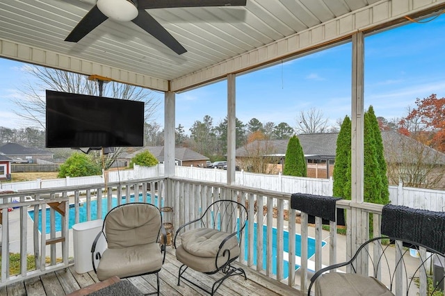 sunroom featuring plenty of natural light and ceiling fan