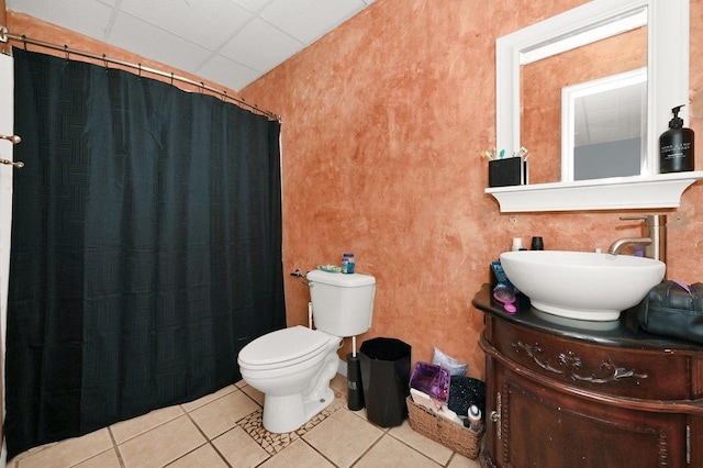 bathroom featuring tile patterned floors, vanity, toilet, and walk in shower