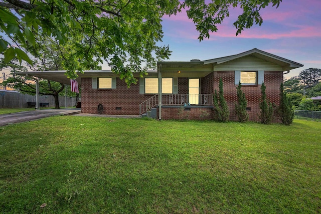  - ranch-style house featuring crawl space, driveway, brick siding, a carport, and covered porch