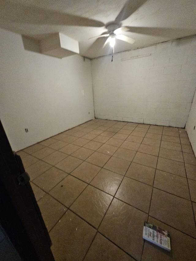 tiled empty room with ceiling fan