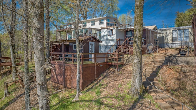 rear view of property with a wooden deck