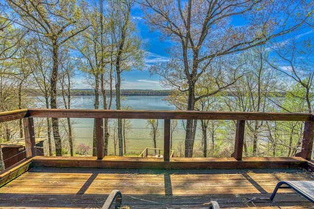 wooden deck with a water view