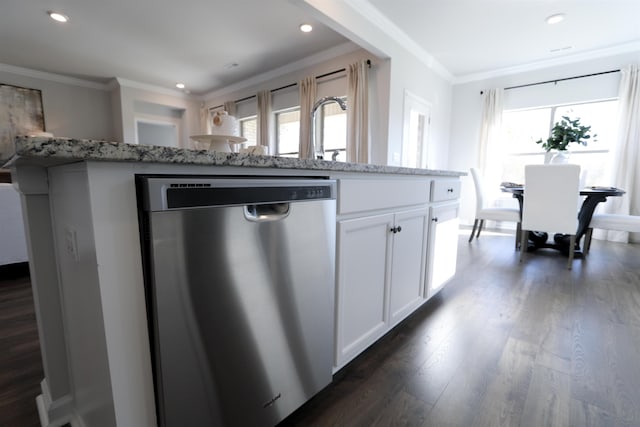 kitchen with light stone counters, white cabinetry, ornamental molding, stainless steel dishwasher, and dark wood-style floors