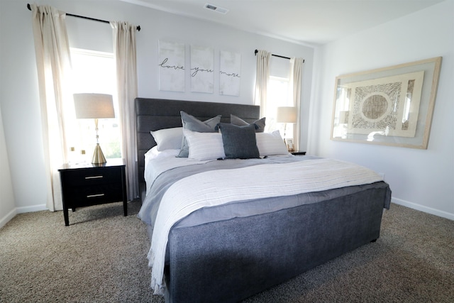 bedroom featuring carpet, visible vents, and baseboards