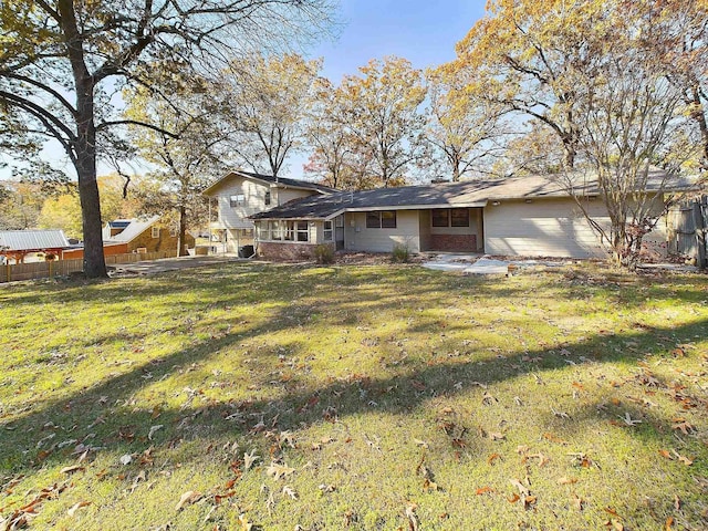 rear view of property featuring a yard