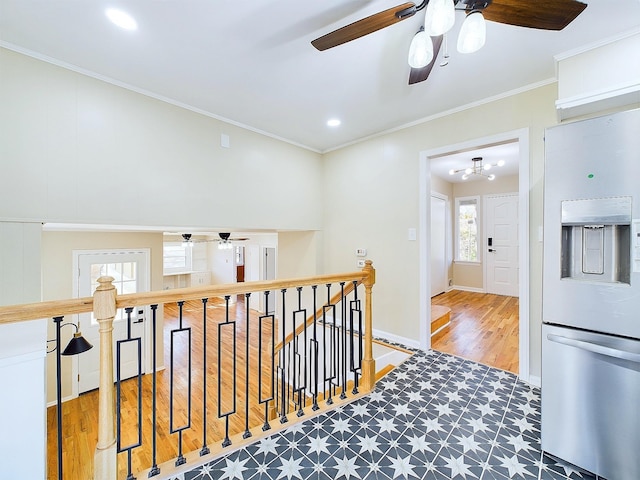 hallway with crown molding and wood-type flooring