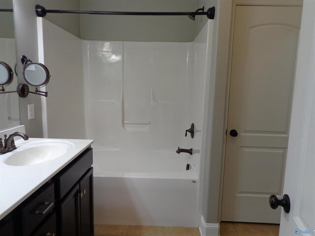  - full bath featuring vanity, tile patterned floors, and bathing tub / shower combination